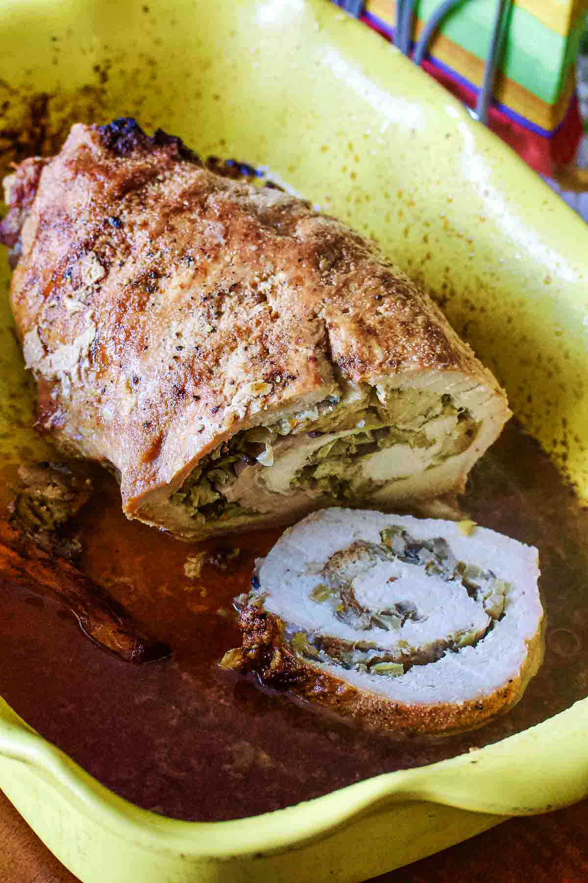 Apple and mushroom stuffed roasted pork tenderloin is a recipe that makes a great alternative for the usual ham around the holidays. Apple And Mushroom Stuffed Roasted Pork Loin prepared for serving.