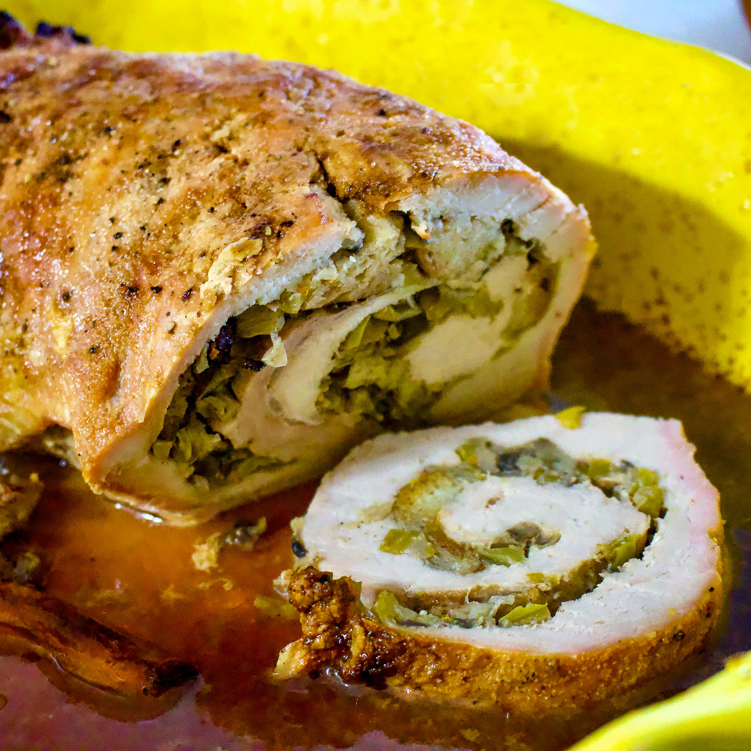 Apple And Mushroom Stuffed Roasted Pork Tenderloin in a yellow pan0