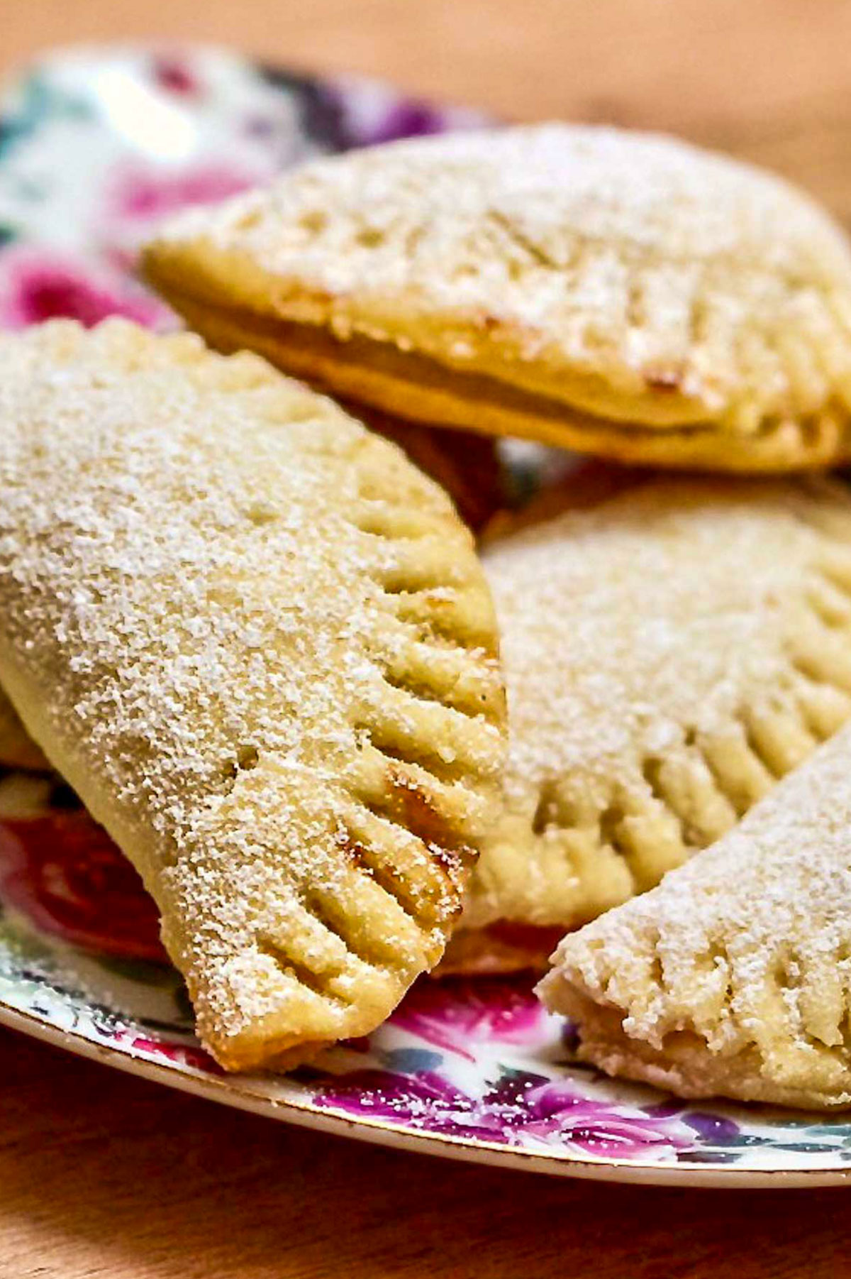 Pie Crust Mini Turnover Cookies With Jam copy Jam filled pocket cookies on plate.