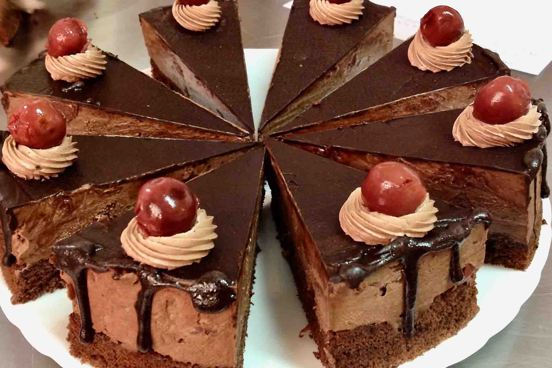 Chocolate Cake With Sour Cherries sliced for serving.