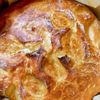No knead bread baked coming out of the oven