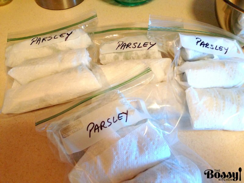 plastic bags filled with parsley for freezing