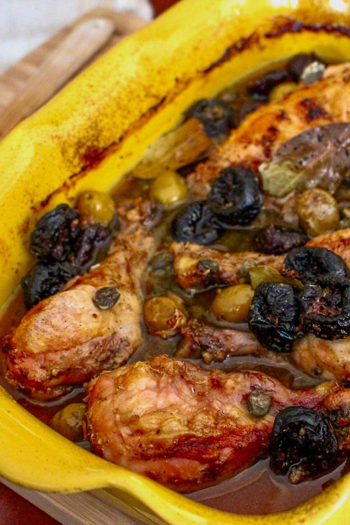 Chicken Marbella served in a yellow baking dish1200
