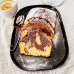 Marble pound cake with powdered sugar close up square photo0