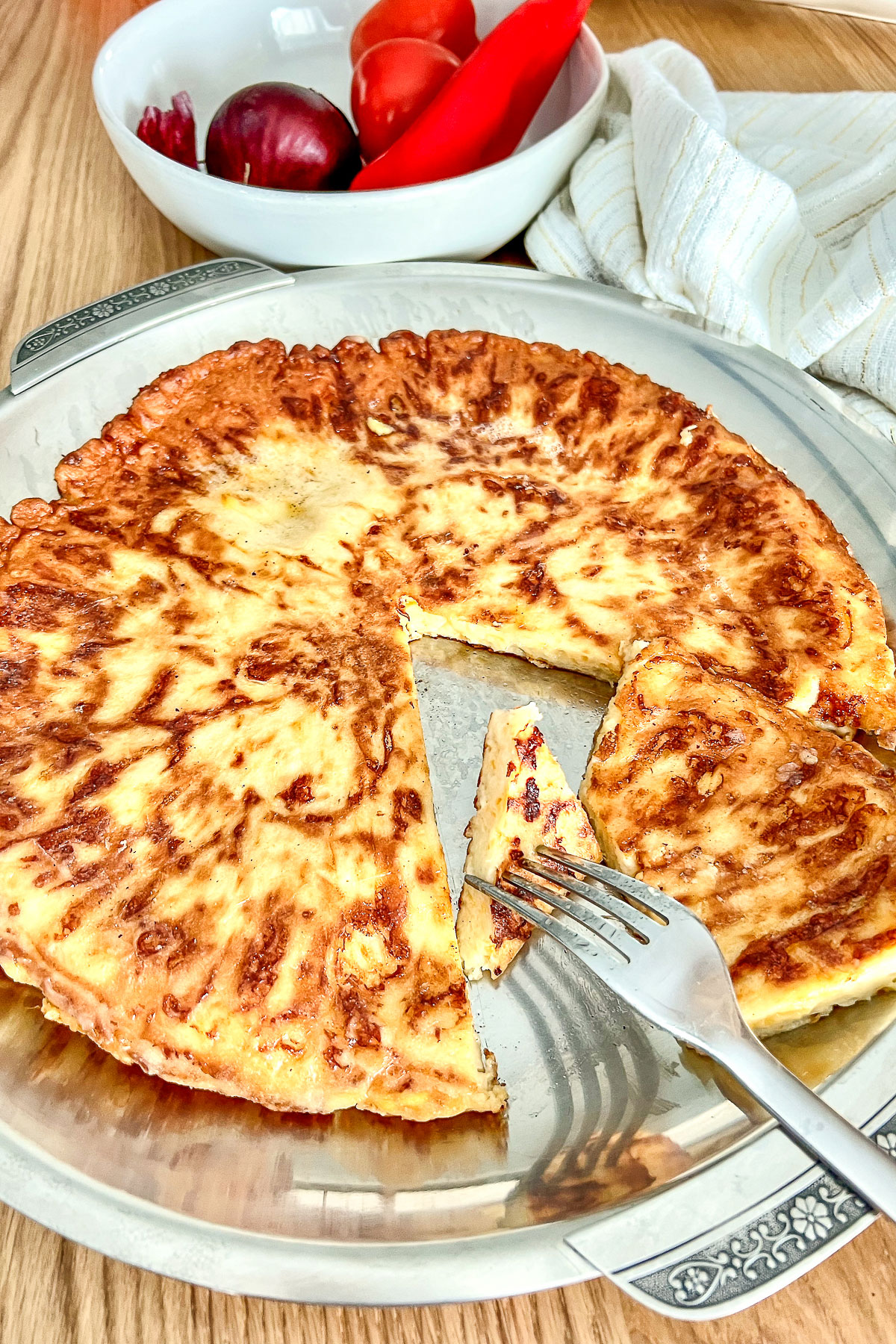Savory Cheese Pie on stainless steel platter.