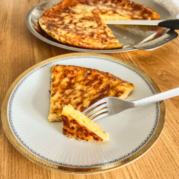 Savory Cheese Pie sliced on a plate with fork square image0