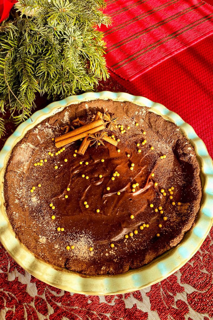 CHOCOLATE TART WITH STAR ANISE AND CINNAMON on table