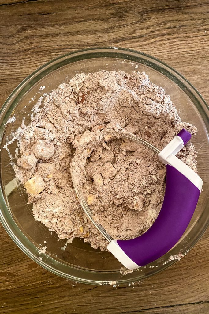 mixing the butter with flour for the chocolate tart crust