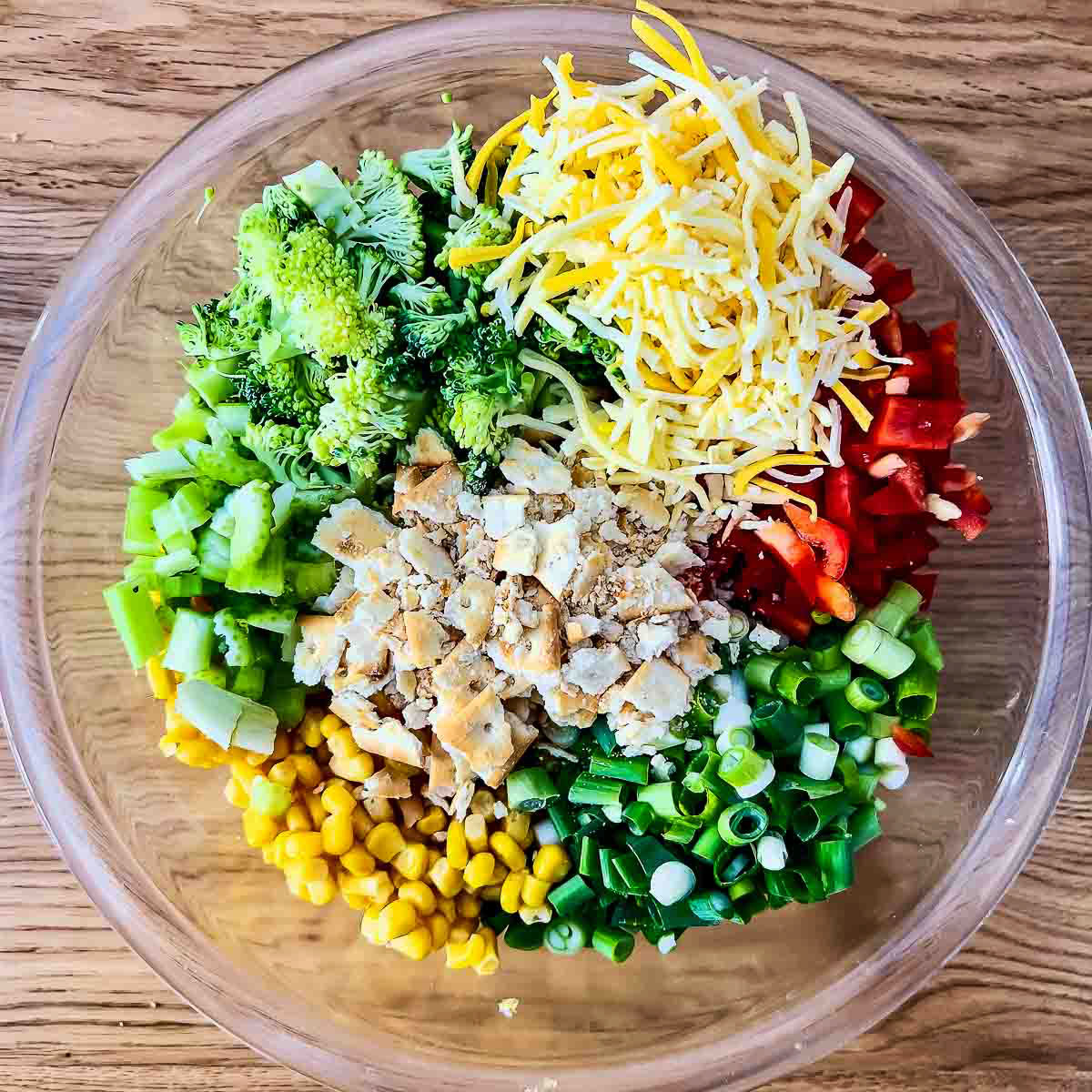 Ingredients for Scalloped Corn in a glass bowl.