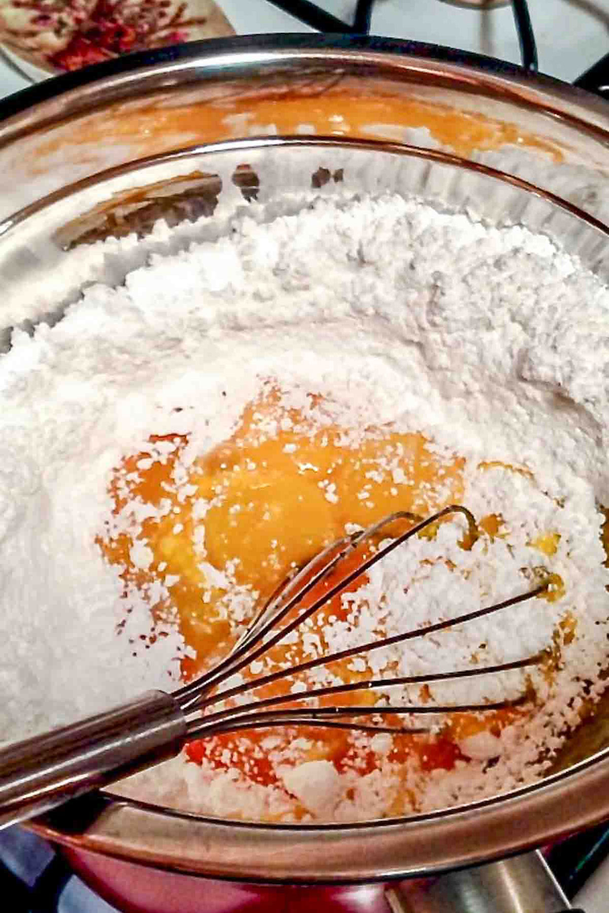 Making the buttercream on the stove.