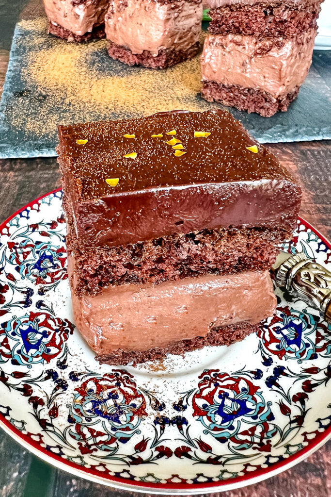 Slice of Rigo Jancsi Chocolate Cake on plate with fork0