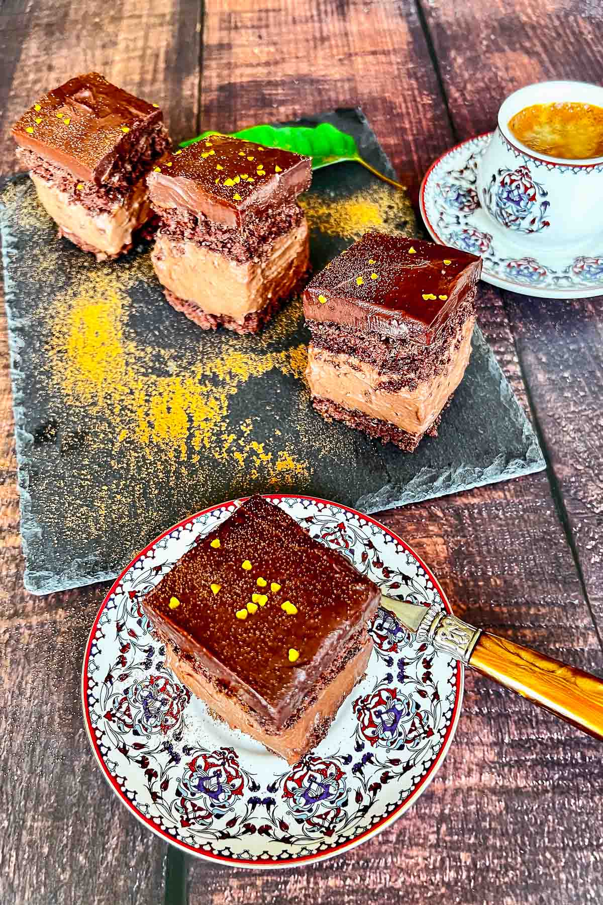 Hungarian Decadent Chocolate Cake- inspired from the original recipe of Rigo Jancsi Cake, an elegant dessert from 19th century in Austro Hungarian Empire. Slices of Rigo Jancsi Chocolate Cake with coffee.