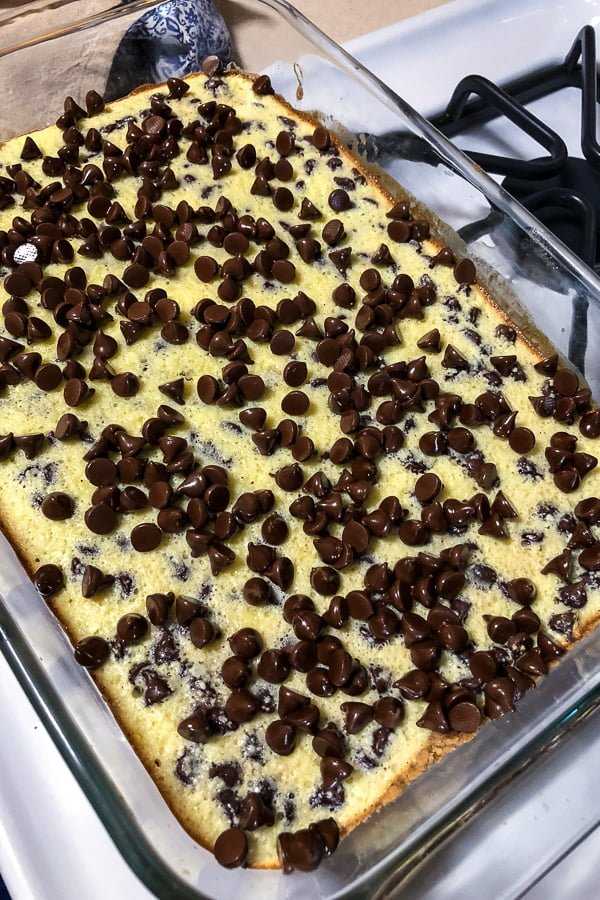 Adding chocolate chips to cream cheese filling.