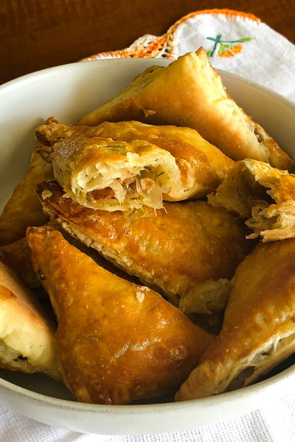 Cabbage puff pastry triangles in a bowl