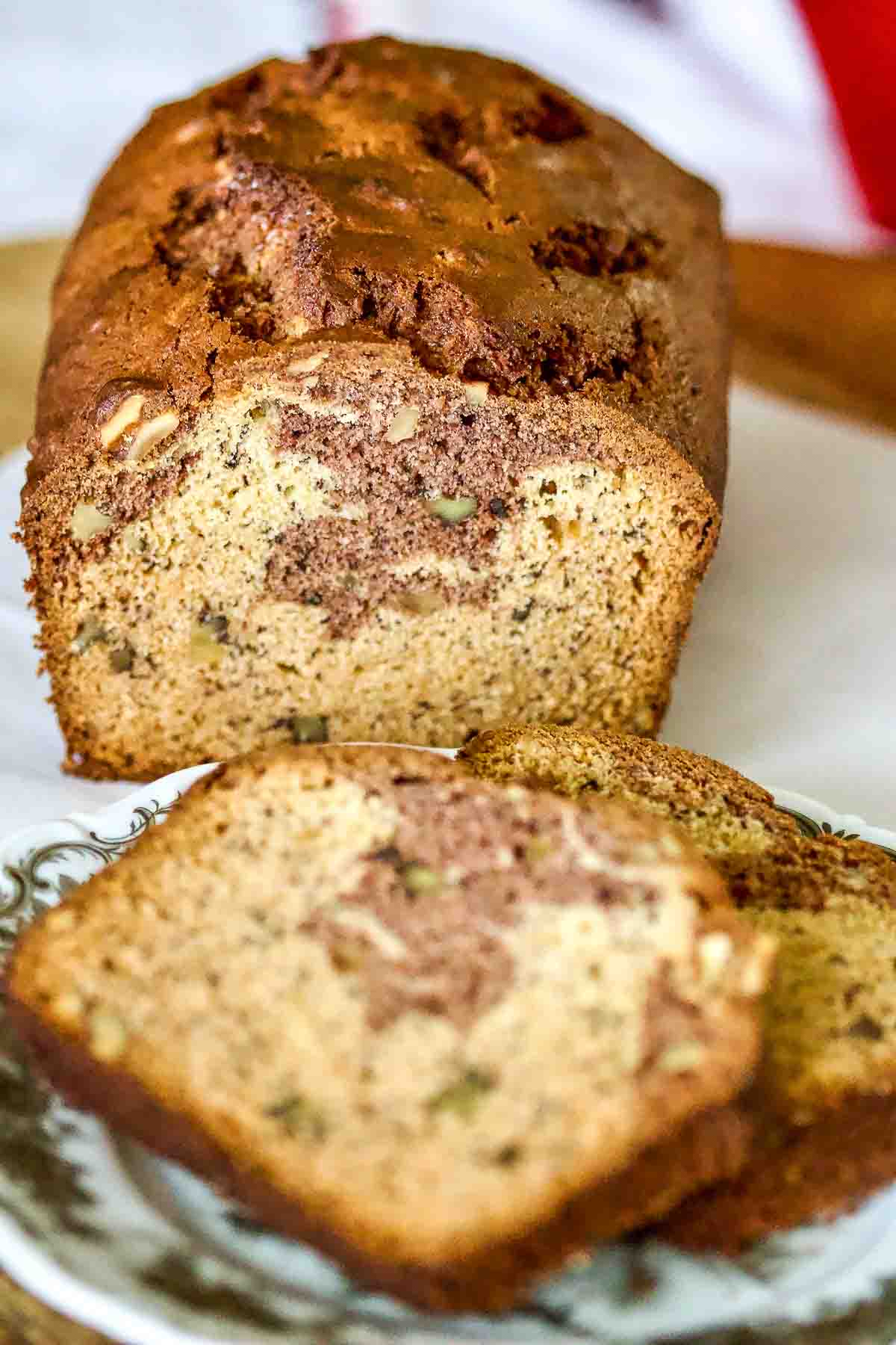 Cocoa Walnuts Banana Bread Recipe0 Cocoa Walnuts Banana Bread sliced on a plate.