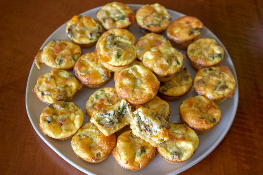 Easy Vegetarian Mini Quiche Recipe - multiple mini quiche on a white platter