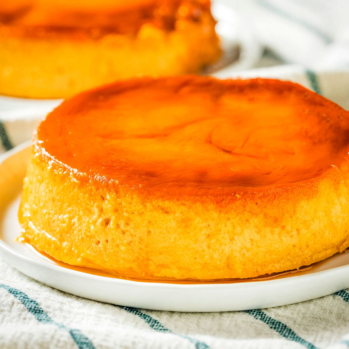 Delicious Flan con queso on a white plate.