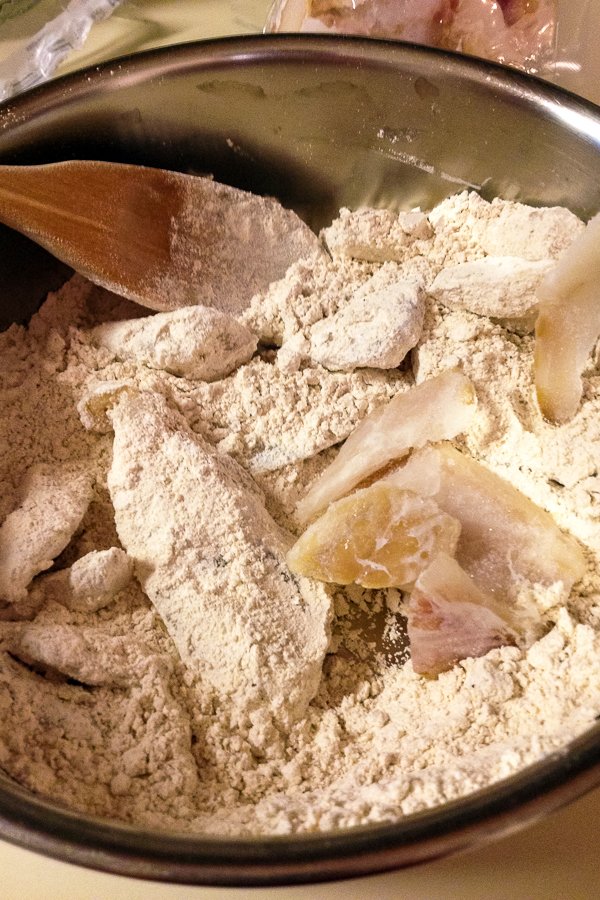 fish tossed in flour for frying