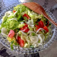 Belgian Endives Boston Lettuce Salad is a simple delicious salad that can be made anytime during the year. Great in the summer though with a glass of wine.