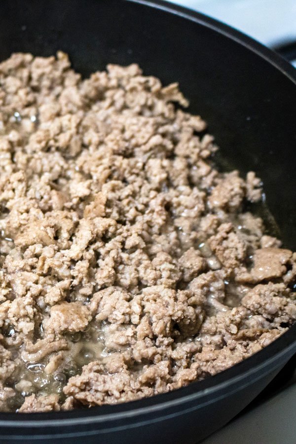 ground meat cooking in a pan
