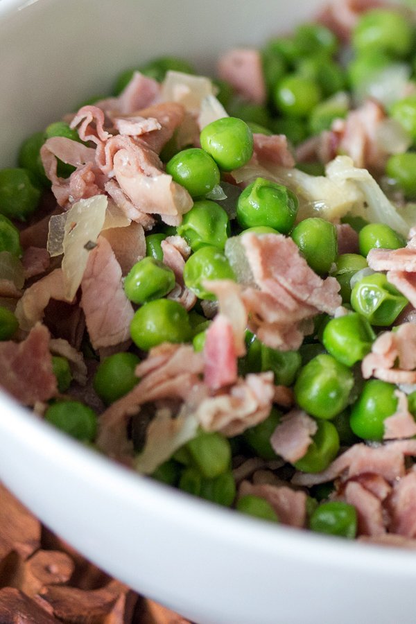 Easy Green Peas With Ham- Spanish recipe- is an easy dish that can be made in no time using fresh or frozen peas. For authenticity, use jamon Serrano. Easy Green Peas With Ham- Spanish recipe- close up