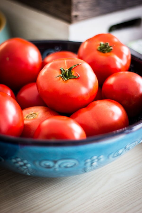 tomatoes in a blue bowl