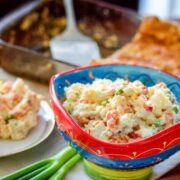 Spanish Ensaladilla Rusa served from a colorful bowl.
