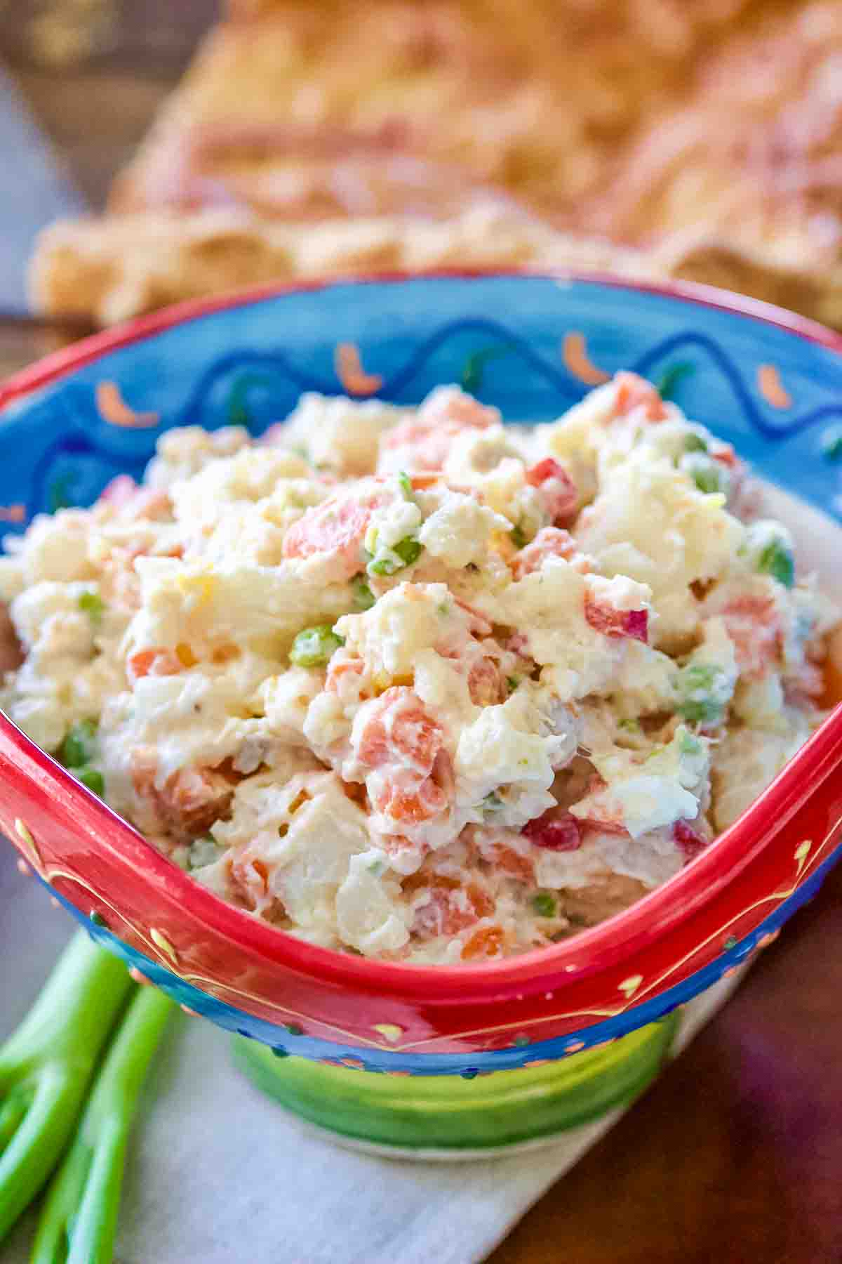 Spanish Potato Salad Ensaladilla Rusa A Spanish Favorite2 1 Spanish ensaladilla rusa in a colorful bowl.