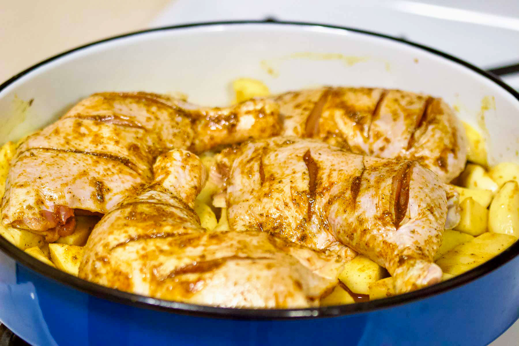 This roasted chicken and potatoes dish is the perfect dish for a Sunday family meal. Easy to make, delicious and perfect to feed a crowd. Chicken Legs and Potatoes ready for roasting.