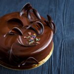 Chocolate Mousse Cake decorated with chocolate pieces.