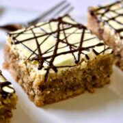 Walnut Cake With Egg Yolk Glaze slice on white plate.
