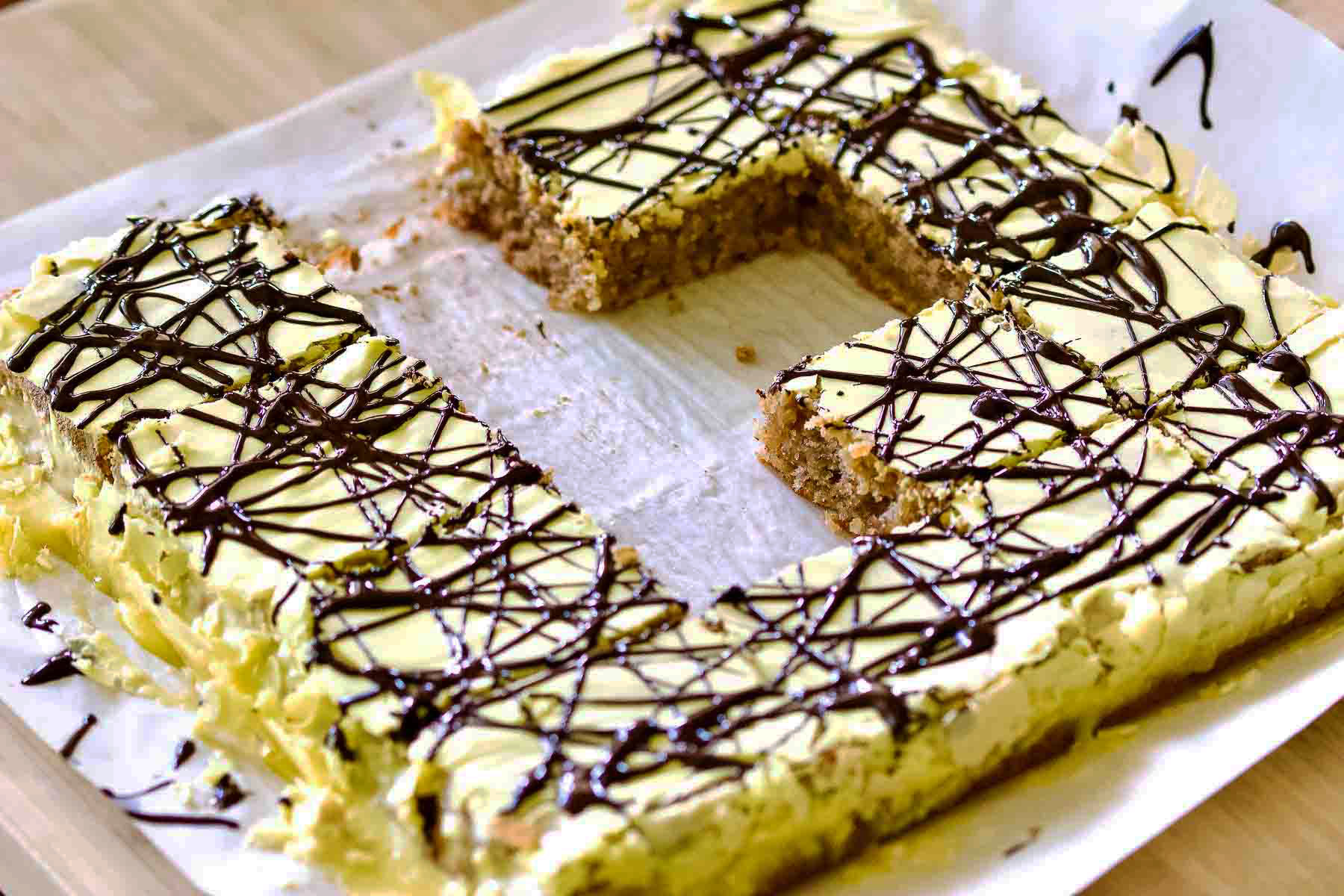 Walnut cake with egg yolk glaze Walnut Cake with Yolk Glaze on baking tray.