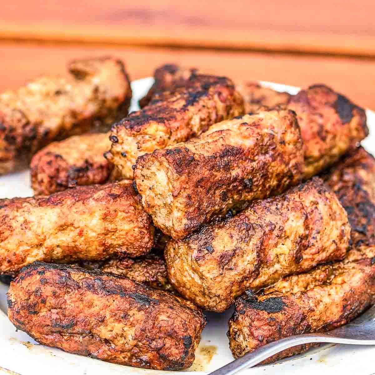 Plate with grilled sausages.