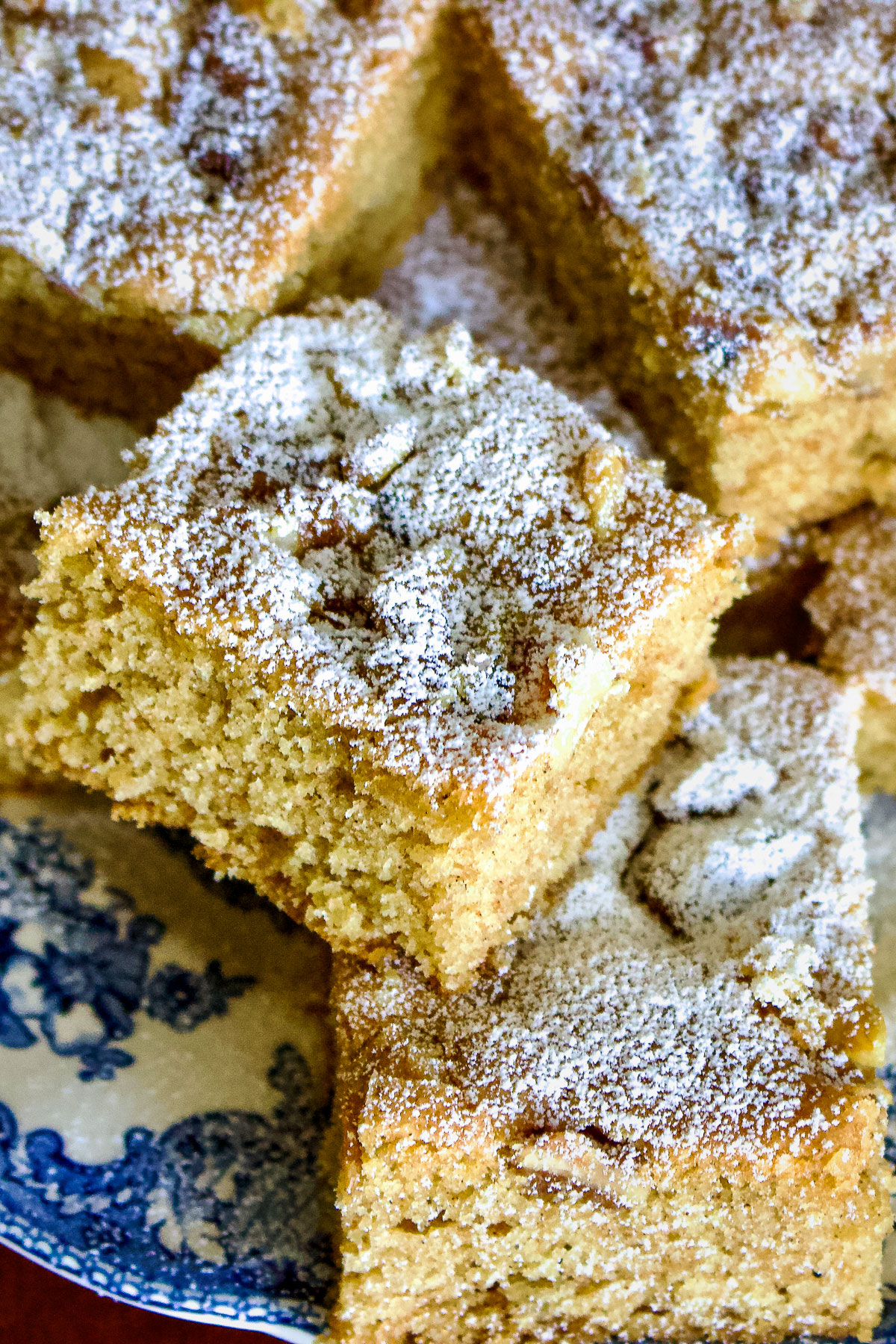 This walnuts and cinnamon coffee cake is an old Saxon recipe coming from Transylvania. My German grandma used to make this recipe very often. The cake is made from a simple batter with butter, sugar, eggs, flour and spices. Before it goes in the oven, the batter is sprinkled with walnuts. Great for breakfast too! Walnut and cinnamon coffee cake close up0