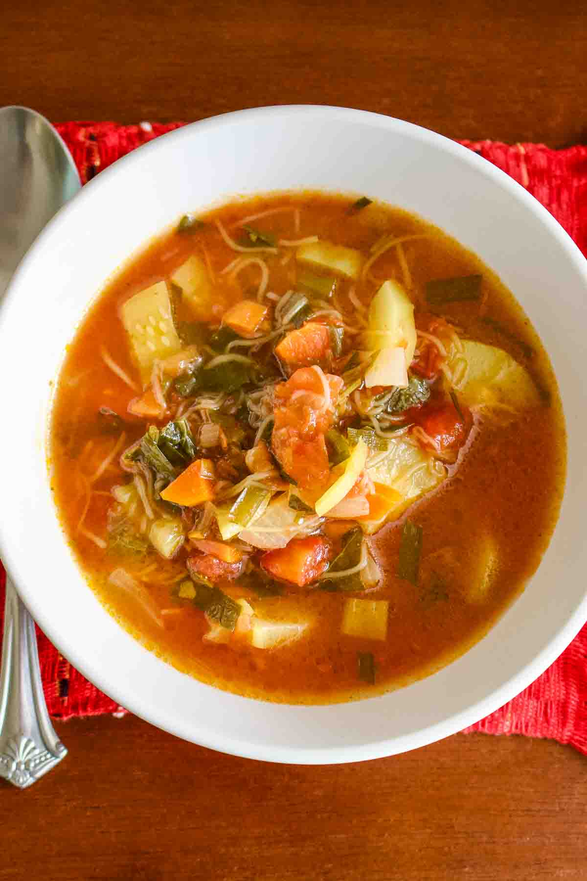 Tomato Zucchini Soup in a white bowl.