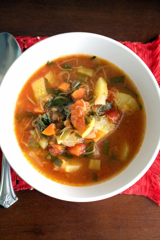 Tomato and Zucchini Summer Soup in a white bowl
