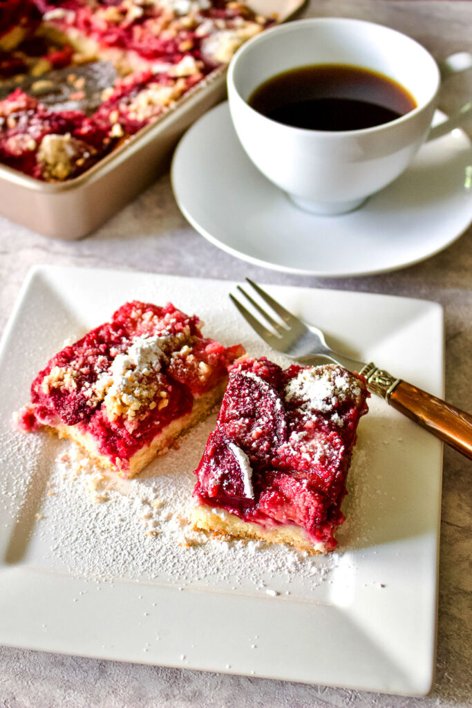 German Plum Kuchen on white plate with fork0