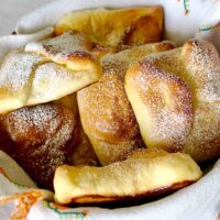Romanian Traditional Sweet Cheese Pastries- Poale in Brau(Branzoaice) are considered to be an emblem of the region of Moldova and its cuisine. The pastries are traditionally made with salty sheep cheese and served as a snack, or with Farmer's Cheese, sugar and raisins for a delicious dessert.