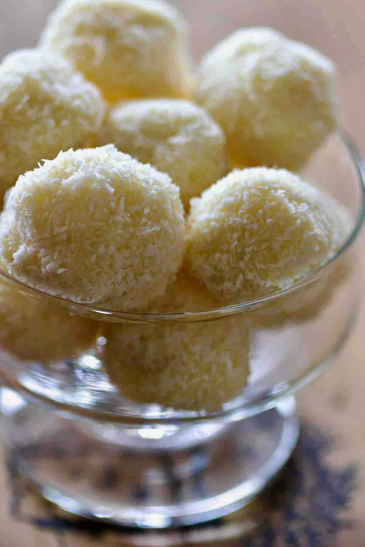 Raffaello Coconut Confections with Almonds in a glass bowl.