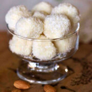 Raffaello Coconut Confections with Almonds in a glass serving bowl.