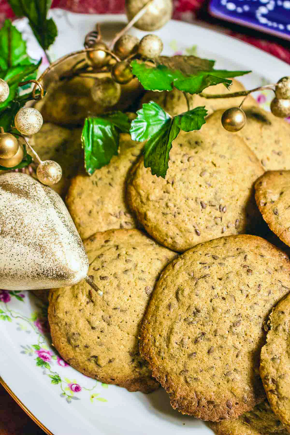 Linseed cookies Linseed Cinnamon Cookies on a platter surrounded with Christmas decorations.