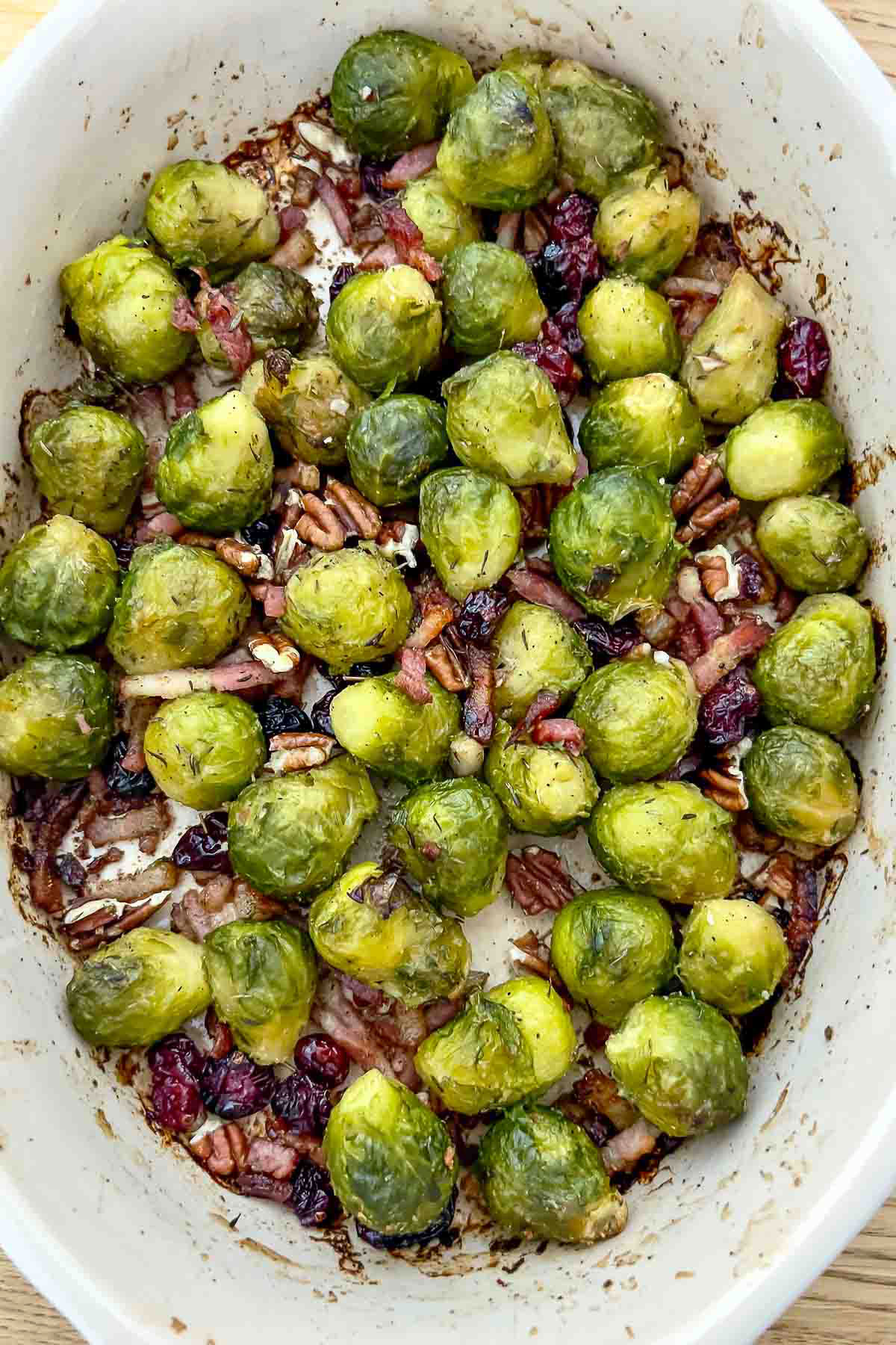 Oven roasted Brussels sprouts with bacon is an easy recipe that can be made for any day of the week. It is also a great recipe for the holidays. Roasted Brussels Sprouts with Bacon out of the oven.