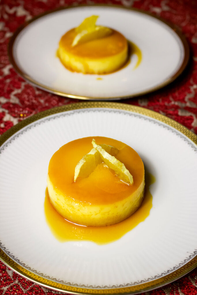 Spanish Orange Almond Flan on dessert white plate