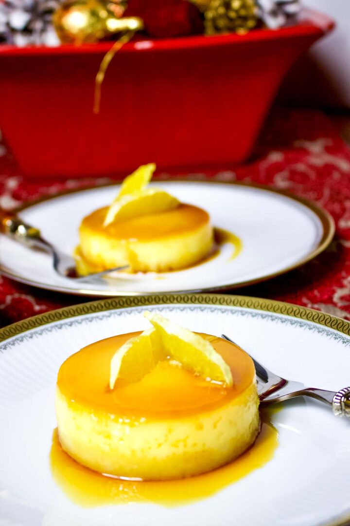Spanish Orange Almond Flan served on white plates.