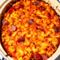 Easy Spanish Chorizo and Tomato Pasta Bake in a white baking dish.