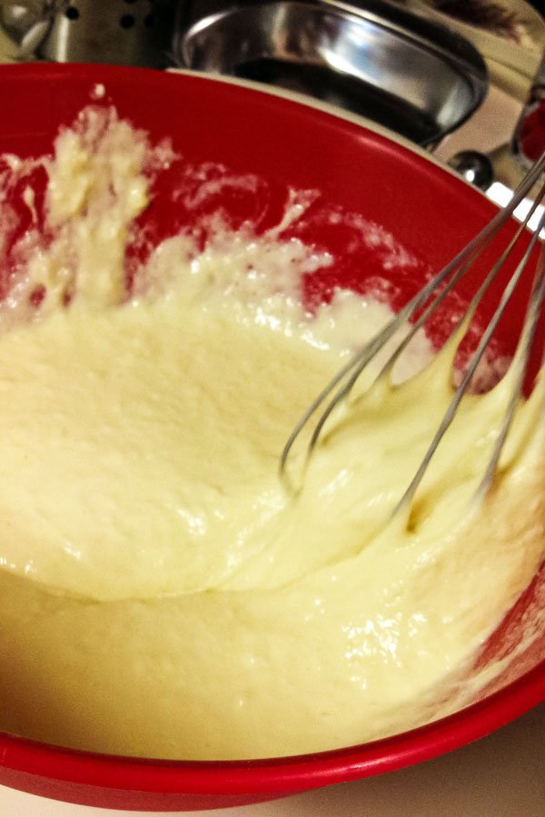 doughnuts batter in a red bowl