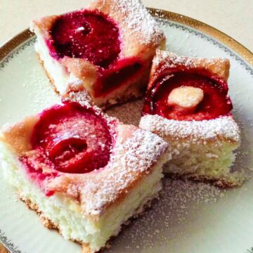 Plum Cake sliced and served on a plate.
