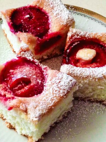 Plum Cake sliced and served on a plate.