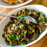 Spanish Mushrooms With Garlic and Lemon served in a white bowl.