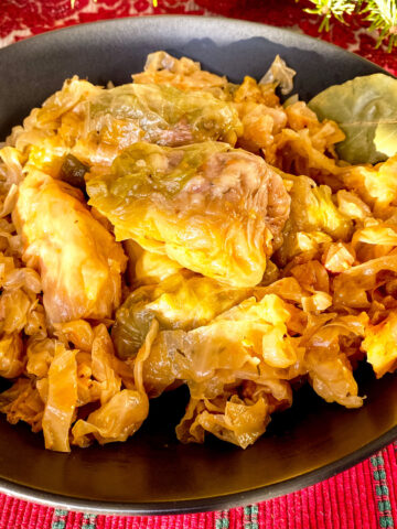 Stuffed cabbage rolls on black bowl square photo1